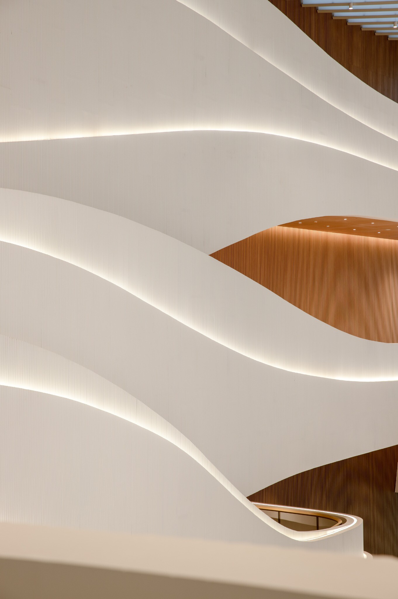View of the spiral exhibition route and stair platform, showing how the central stair and raised platforms support lingering, display, and events.
