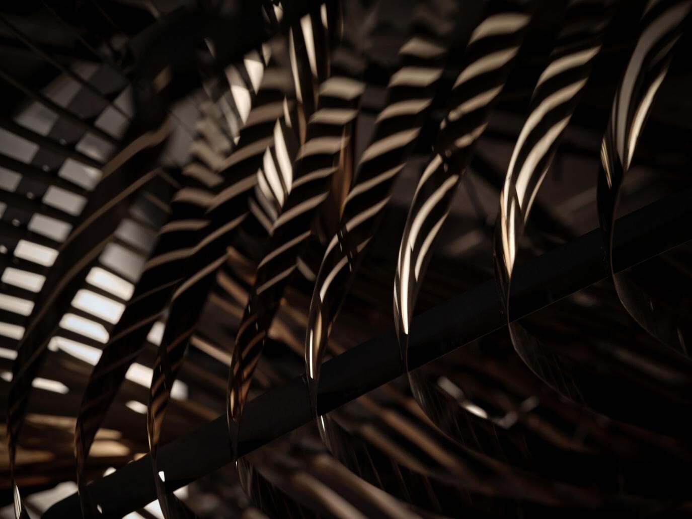 Detail of the metal roof installation, where metal sheets reflect light and create shifting brightness like sunset glints on the sea.