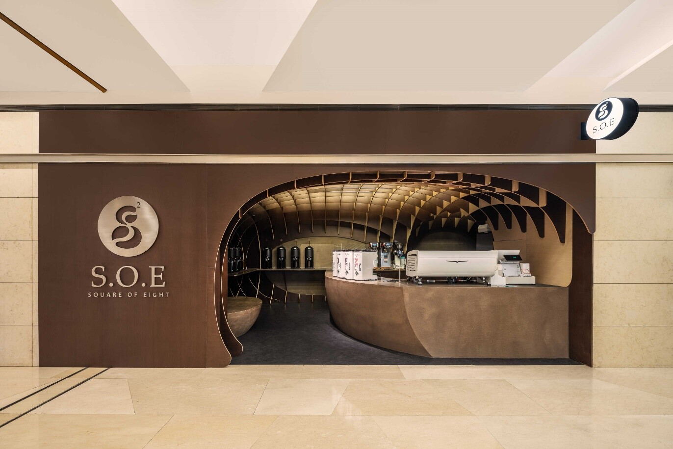 Entrance interface of S.O.E Coffee Store, where black-and-white chessboard logic becomes a three-dimensional waffle structure and the coffee-bean curve shapes the store.